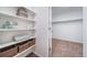 Walk-in closet with built-in shelving and carpet at 3928 N Riviera Ct, Aurora, CO 80019