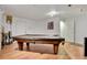 Finished basement showcasing a pool table, laminate floors, and recessed lighting at 2660 S University Blvd # I, Denver, CO 80210