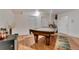 Bright basement featuring a pool table, laminate floors, and neutral decor at 2660 S University Blvd # I, Denver, CO 80210