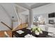 Elegant dining area adjacent to the living room with natural light and stylish decor at 2660 S University Blvd # I, Denver, CO 80210