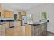 Well-lit kitchen boasts stainless steel appliances, granite countertops, and a convenient breakfast bar at 2660 S University Blvd # I, Denver, CO 80210