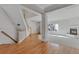 Bright living room boasts hardwood floors, fireplace, and open floor plan with stairs and natural light at 2660 S University Blvd # I, Denver, CO 80210