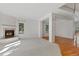 Open-concept living room with fireplace, wood floors, and bright windows creates a welcoming atmosphere at 2660 S University Blvd # I, Denver, CO 80210