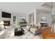 Elegant living room with a cozy fireplace and an open concept dining area for entertaining at 2660 S University Blvd # I, Denver, CO 80210