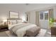 Serene main bedroom featuring two windows, ample natural light, and a neutral color palette at 2660 S University Blvd # I, Denver, CO 80210