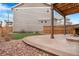 Backyard featuring rock landscaping and concrete patio at 10234 Yampa Ct, Commerce City, CO 80022