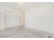 Spacious bedroom with neutral carpet and large sliding closet at 10234 Yampa Ct, Commerce City, CO 80022