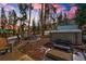 Inviting backyard retreat featuring a relaxing hot tub and cozy seating area near scenic trees at 89 Fairview Cir, Breckenridge, CO 80424