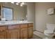 Well-lit bathroom features wooden cabinets, and tile flooring, with a modern toilet at 89 Fairview Cir, Breckenridge, CO 80424