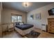 Bedroom with a queen bed, small nightstands, wood floor and large window with view at 89 Fairview Cir, Breckenridge, CO 80424