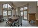 Bright dining room with wood table, chandelier, bench, and large windows at 89 Fairview Cir, Breckenridge, CO 80424