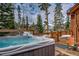 Relax in this outdoor hot tub with serene views of the surrounding landscape; perfect for unwinding after a long day at 89 Fairview Cir, Breckenridge, CO 80424