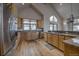 Open kitchen with wood floors, stainless steel appliances, and lots of sunlight at 89 Fairview Cir, Breckenridge, CO 80424