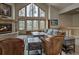 Inviting living room with stone fireplace, vaulted ceilings, and oversized windows for natural light at 89 Fairview Cir, Breckenridge, CO 80424