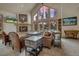 Cozy living room featuring a stone fireplace, large windows, and comfortable seating arrangement for Gathering and guests at 89 Fairview Cir, Breckenridge, CO 80424