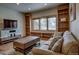 Cozy living room with a comfortable couch, wooden table, and view from the large window at 89 Fairview Cir, Breckenridge, CO 80424
