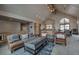 Spacious open-concept living room with vaulted ceilings seamlessly connecting to the dining area at 89 Fairview Cir, Breckenridge, CO 80424