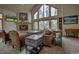 Inviting living room with stone fireplace, vaulted ceilings, and oversized windows for natural light at 89 Fairview Cir, Breckenridge, CO 80424