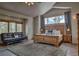 Spacious main bedroom with a couch, large windows and comfortable bed at 89 Fairview Cir, Breckenridge, CO 80424