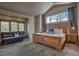 Main bedroom features vaulted ceilings, large windows, and comfortable seating area at 89 Fairview Cir, Breckenridge, CO 80424