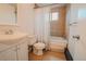 Standard bathroom with shower-tub combo, light-colored tile, and traditional fixtures at 558 N Washington St # 103, Denver, CO 80203