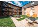 Beautiful courtyard showing exterior stairways and outdoor seating area of the apartment complex at 558 N Washington St # 103, Denver, CO 80203