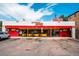Exterior view of Brothers BBQ restaurant featuring front parking and outdoor seating at 558 N Washington St # 103, Denver, CO 80203