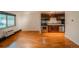 Living room and kitchen with hardwood floors and stainless steel appliances, offering a functional and modern space at 558 N Washington St # 103, Denver, CO 80203