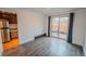 Living room area with wood floors and a sliding door leading to a patio at 558 N Washington St # 103, Denver, CO 80203