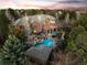 Stunning aerial view of a luxurious home with a pool, hot tub, and lush landscaping at 5851 S Colorado Blvd, Greenwood Village, CO 80121