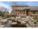 Luxury home with an inviting patio, pond, and outdoor seating areas at 5851 S Colorado Blvd, Greenwood Village, CO 80121