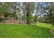 Spacious backyard with well maintained lawn and mature trees at 5851 S Colorado Blvd, Greenwood Village, CO 80121