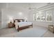 Cozy bedroom with a large rug, tray ceiling, and natural light at 5851 S Colorado Blvd, Greenwood Village, CO 80121