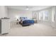 Spacious bedroom with plush carpet, a ceiling fan, and ample natural light at 5851 S Colorado Blvd, Greenwood Village, CO 80121