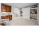 Versatile bonus room featuring custom built-in shelving and wet bar at 5851 S Colorado Blvd, Greenwood Village, CO 80121