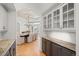 Elegant dining room with a decorative ceiling, chandelier, and convenient access to a butler's pantry area at 5851 S Colorado Blvd, Greenwood Village, CO 80121