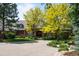 Charming brick home with a circular driveway and mature landscaping at 5851 S Colorado Blvd, Greenwood Village, CO 80121