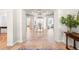 Elegant foyer with tile flooring, chandelier and arched doorways at 5851 S Colorado Blvd, Greenwood Village, CO 80121