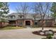 Beautiful brick home with manicured lawn and circular driveway, perfect for upscale living at 5851 S Colorado Blvd, Greenwood Village, CO 80121