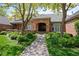 Lovely brick home with manicured landscaping, covered entrance, and well-maintained facade at 5851 S Colorado Blvd, Greenwood Village, CO 80121