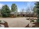 Lovely exterior of a brick home with a spacious front yard and mature trees at 5851 S Colorado Blvd, Greenwood Village, CO 80121