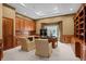 Spacious office featuring custom wood built-ins, a large desk, and natural light at 5851 S Colorado Blvd, Greenwood Village, CO 80121