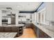 Bright kitchen with stainless steel appliances, a large island, and wooden cabinetry at 5851 S Colorado Blvd, Greenwood Village, CO 80121