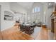 Bright living room featuring hardwood floors, vaulted ceilings, and large windows at 5851 S Colorado Blvd, Greenwood Village, CO 80121