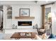 Modern living room with a fireplace, built-in shelves, and a cozy seating area at 5851 S Colorado Blvd, Greenwood Village, CO 80121