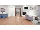 Expansive living room with hardwood floors, built-in shelving, and wet bar area at 5851 S Colorado Blvd, Greenwood Village, CO 80121