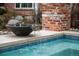 Close-up of the pool showing the fountain and brick accents at 5851 S Colorado Blvd, Greenwood Village, CO 80121