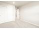 This bedroom has neutral-colored walls and carpeting with a closet at 24008 E Atlantic Pl, Aurora, CO 80018