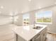 Bright, open kitchen featuring quartz counters, stainless steel appliances and a view of the outdoors at 24008 E Atlantic Pl, Aurora, CO 80018