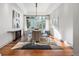 Modern dining room with large windows, hardwood floors, and stylish lighting perfect for gatherings at 2704 Castle Brook Dr, Castle Rock, CO 80108